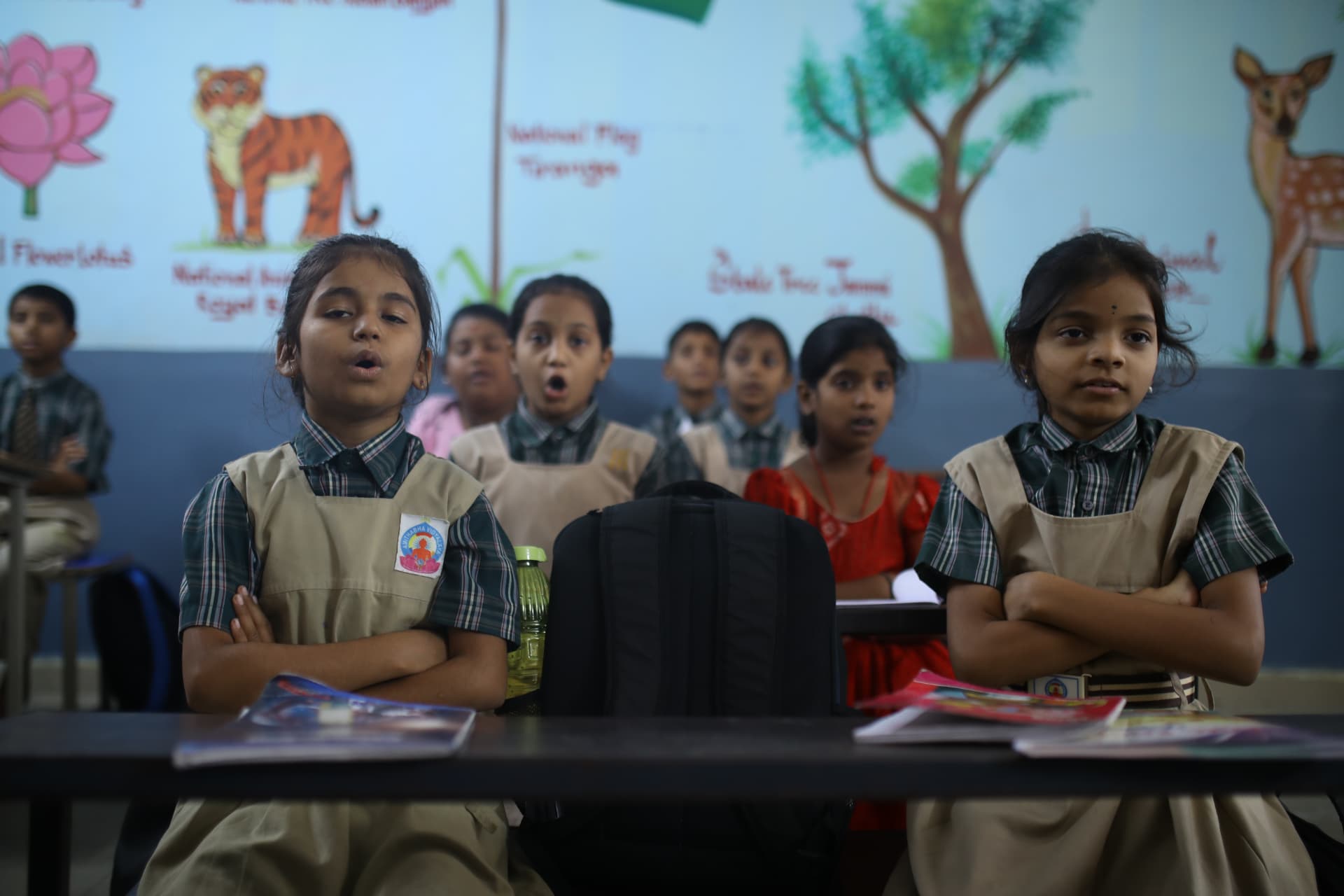 Aadarana students reciting together in a classroom