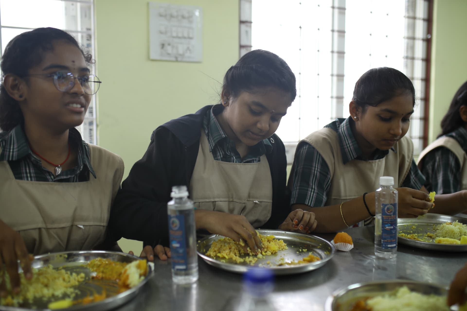 Aadarana students eating lunch together in the dining hall