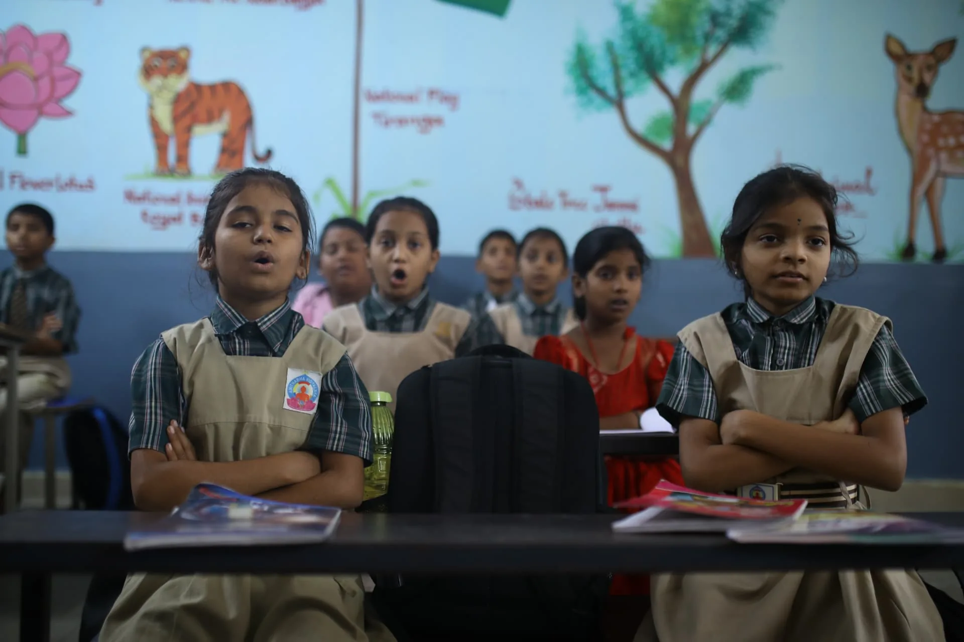 Aadarana students reciting together in a classroom