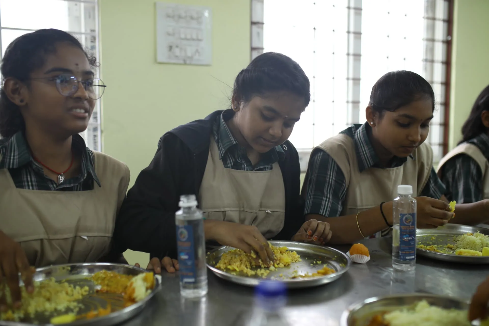 Aadarana students eating lunch together in the dining hall